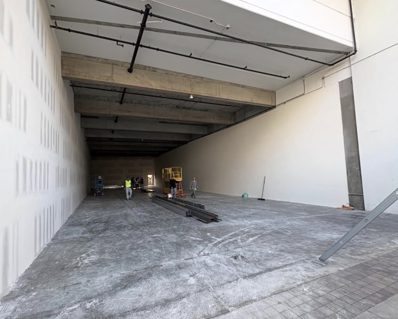 Exterior loading dock area with overhead conduit runs